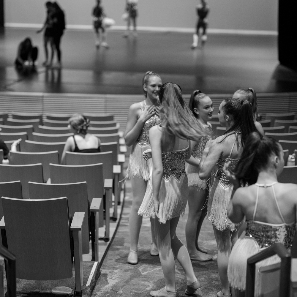 Dancers at a rehearsal getting ready to perform a jazz dance number