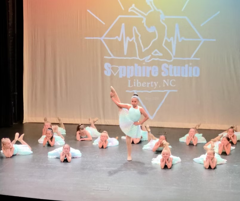 Young dancers performing on stage through the Fundamental Program