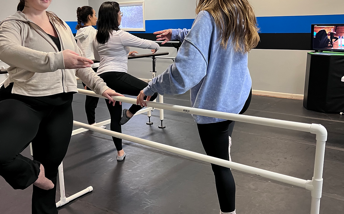 Adult dancers discovering the power of movement at the barre