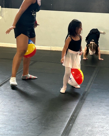 A young dancer finding friends in her Pre-Dance class
