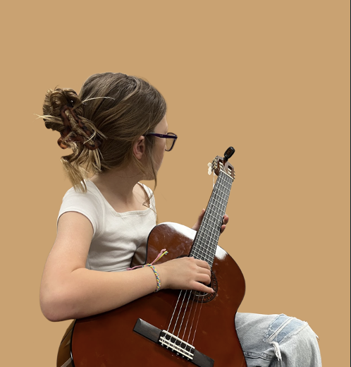 Guitar instructor playing.