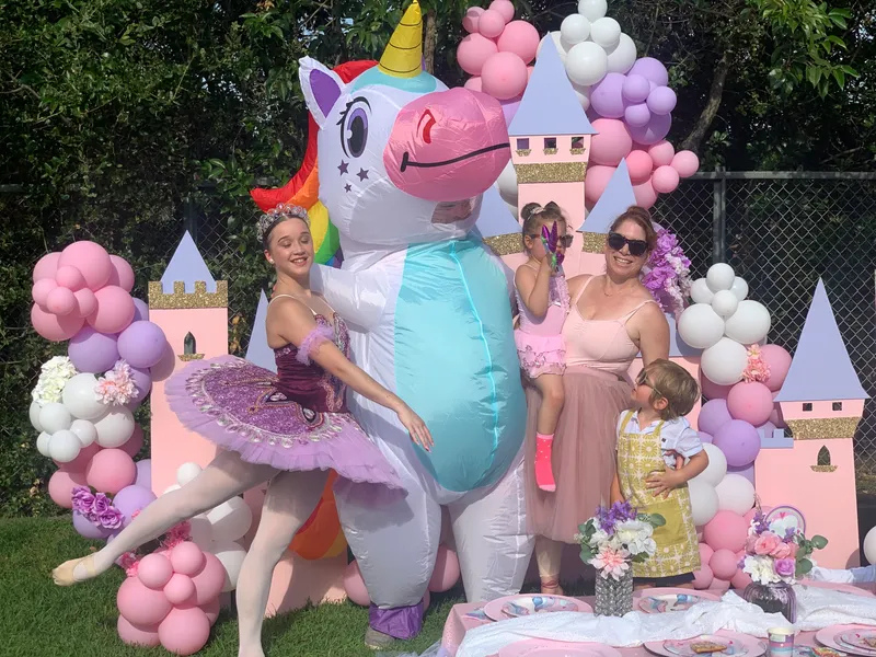 Dancer with Blow Up Unicorn at a Birthday Party